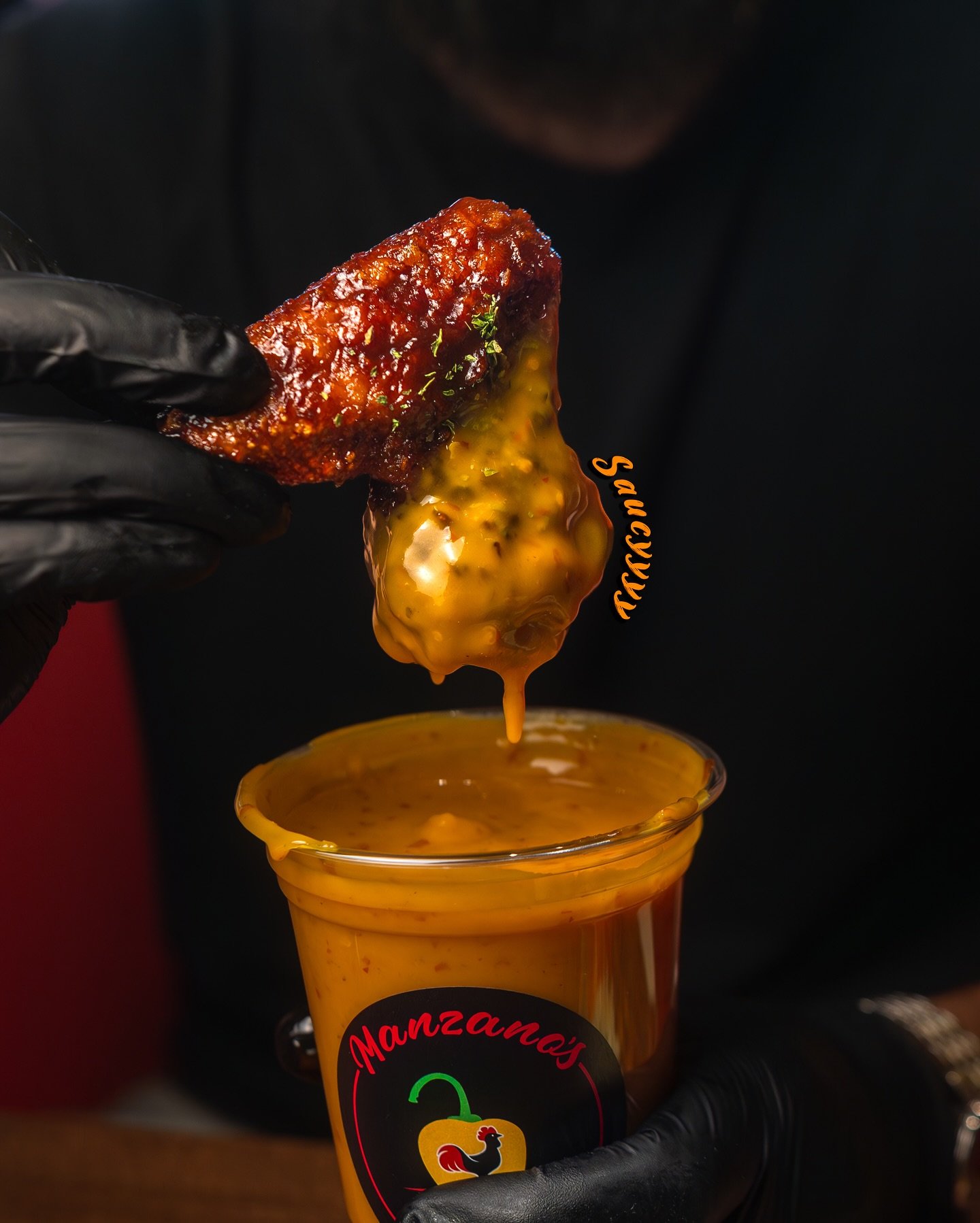 Sticky saucy peri peri wing with dip at Manzanos